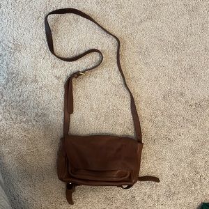 COS crossbody leather satchel.